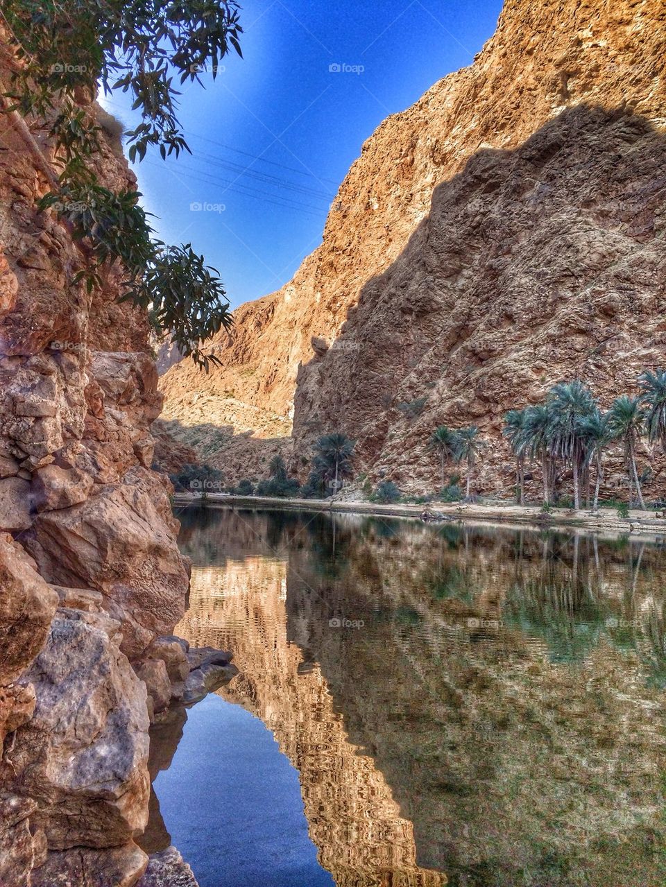 Rocky mountain reflecting in river