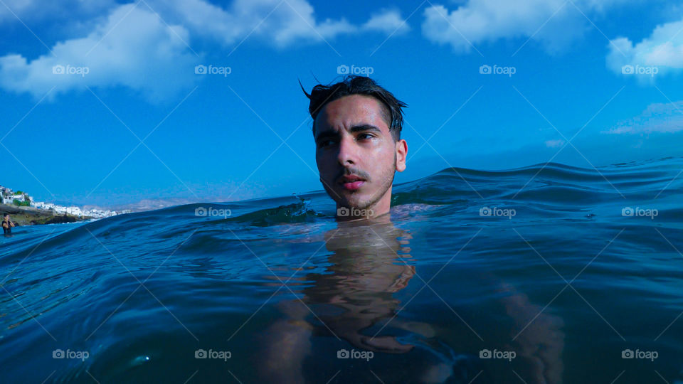 Young man swimming