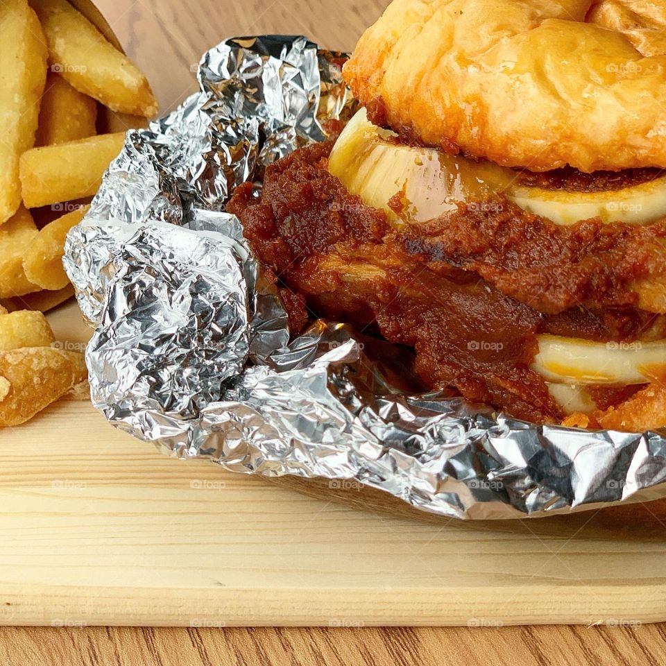 Peranankan styled chicken rendang burger with thick chunky fries 