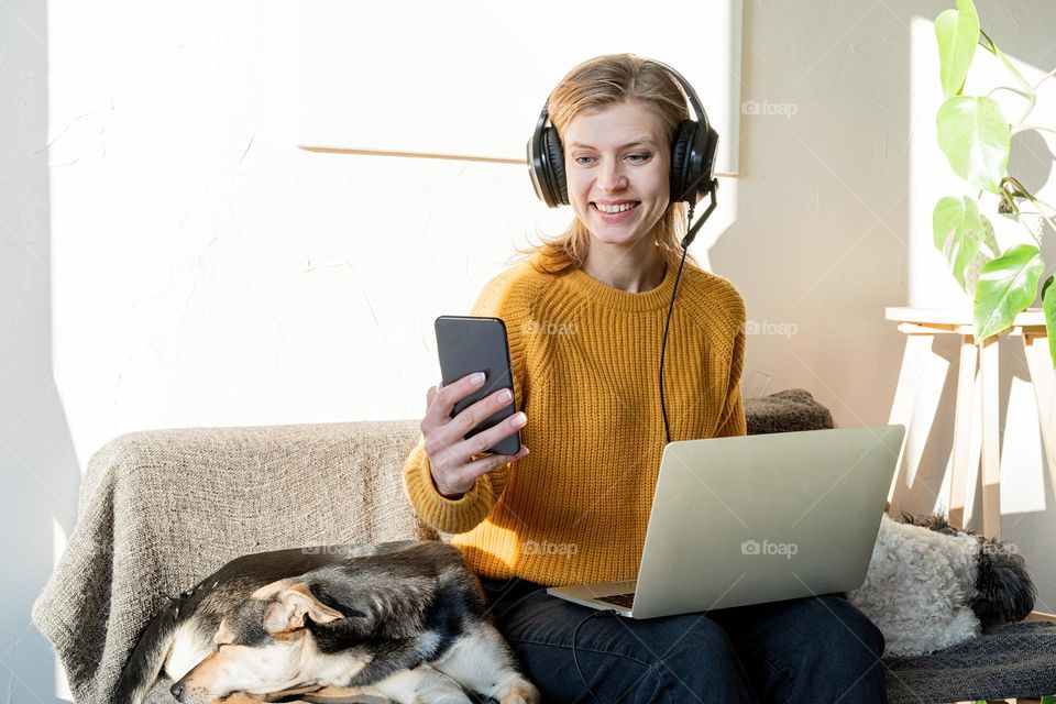 woman on sofa working from home