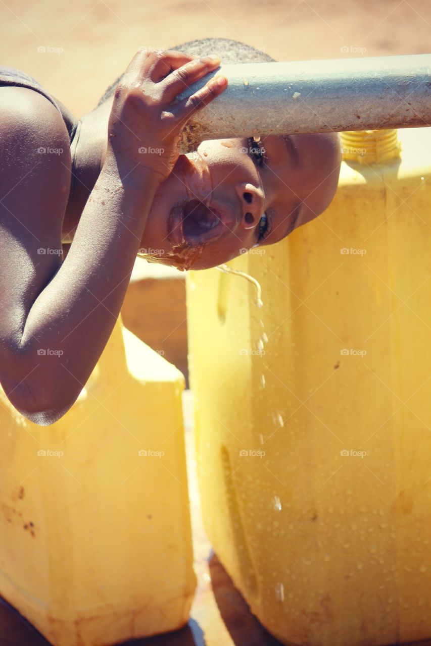 Water. Everyday in Uganda you will see children as young as 3 carrying yellow water jugs on their head. As the grow so do their jugs. After visiting Africa and seeing how people walk for miles to get clean water I'm so much more aware of my usage here back in the USA