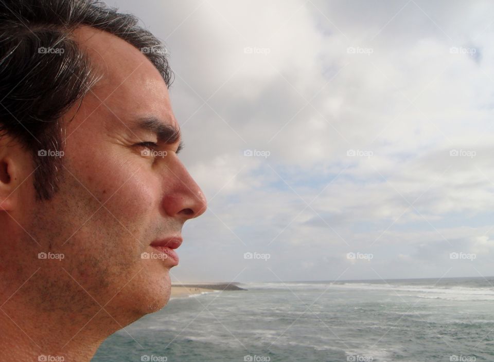 a person looking and enjoying of the sea