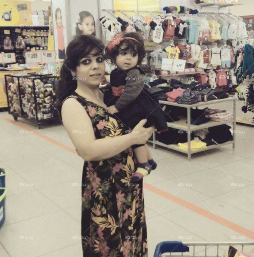 lady with cute baby in shoping mall