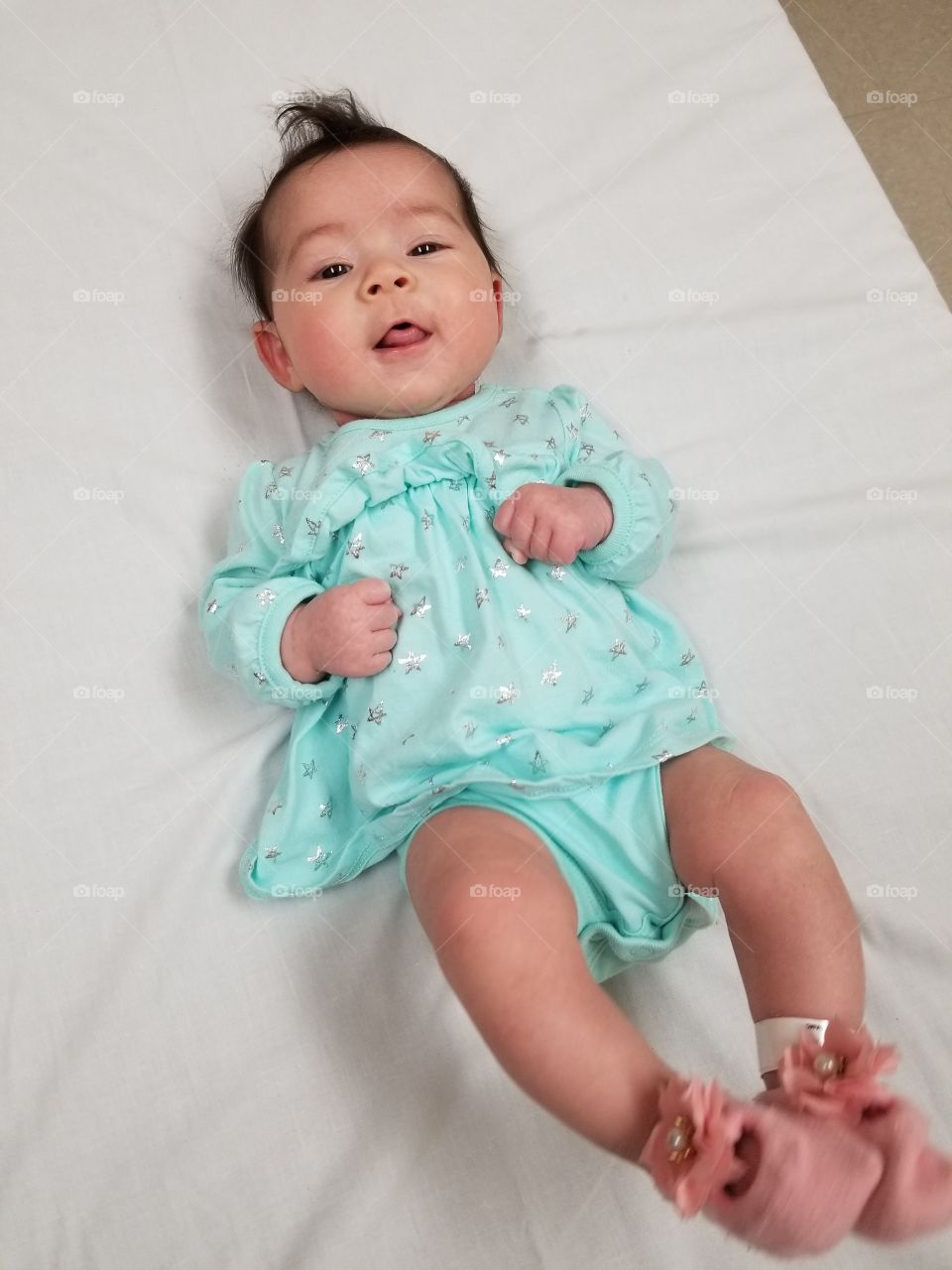 Baby Isabella at the hospital in blue dress