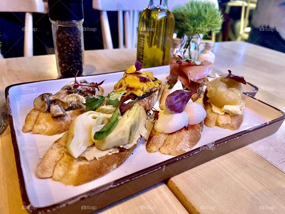 A wood tables with sone delicious food