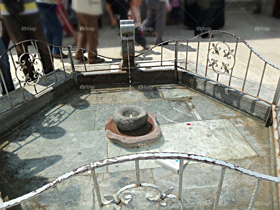 photo of carved stone water dispenser