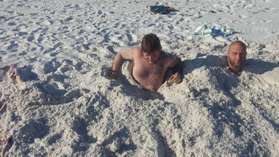 digging self out of sand in Destin Florida