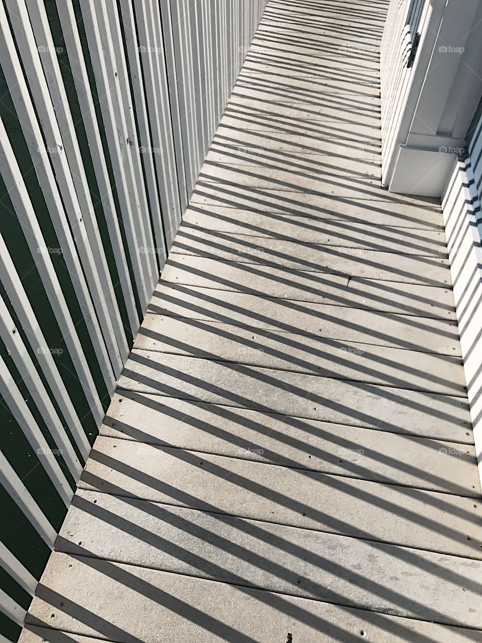 Rail shadows on walkway