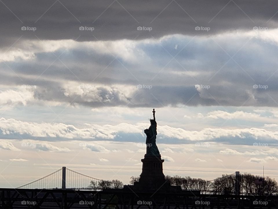 A breathtaking silhouette of Lady Liberty.