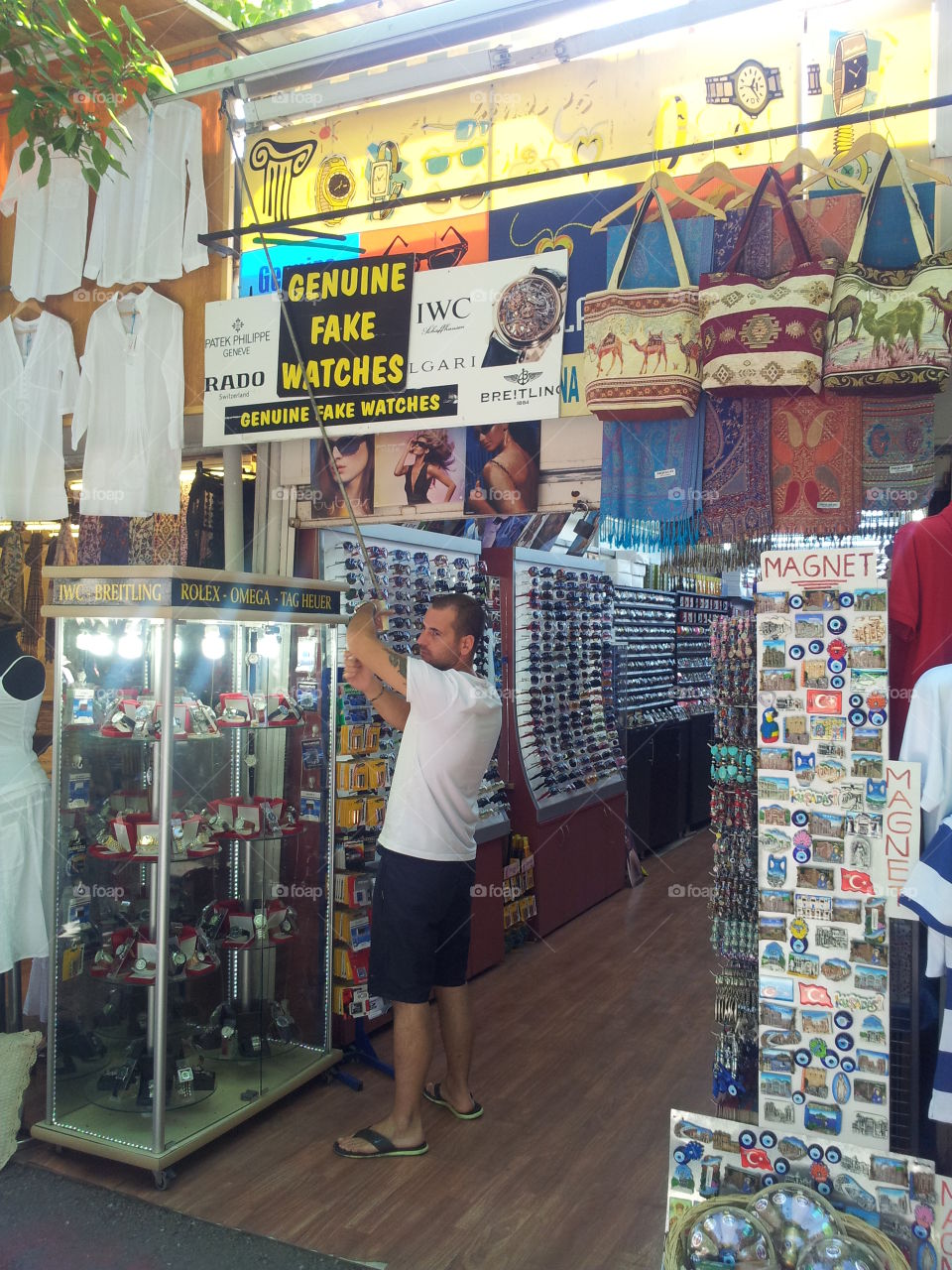The sign on top reads: genuine fake watches.  This is Ephesus.