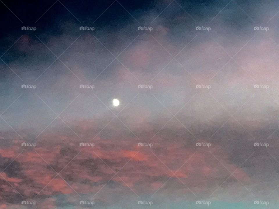 Eerie Sunset with super moon visible & colors.