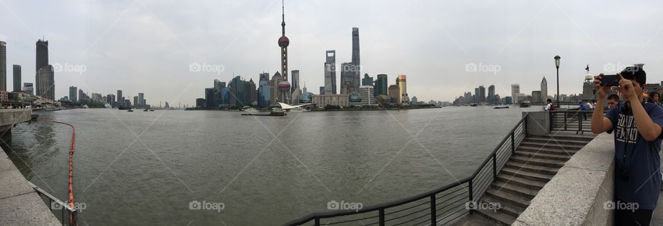 The Bund, Shanghai, China(pan). In this panoramic photograph, the Huangpu river can be seen under the unique skyscrapers of Shanghai. Enjoy!