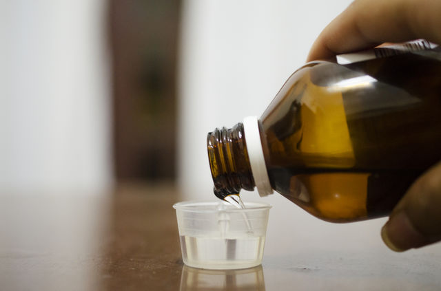 Pouring medicine 
