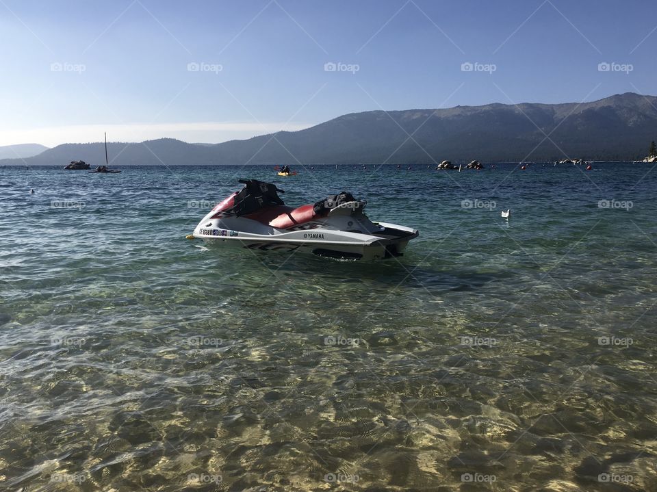 Abandoned jet ski on the lake