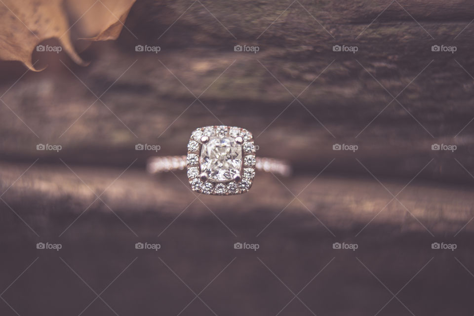Engagement ring in wood.