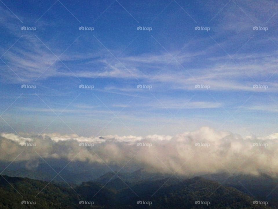 The different weather between the clouds. -- Sunny day