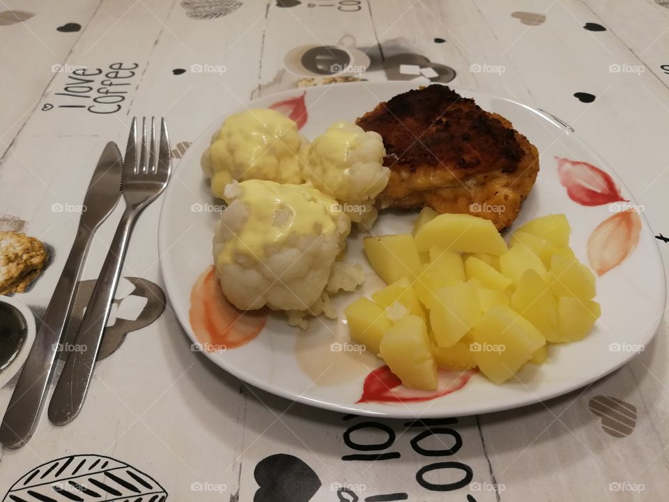 Chicken cordon bleu, boiled potatoes, cauliflower with hollandaise sauce