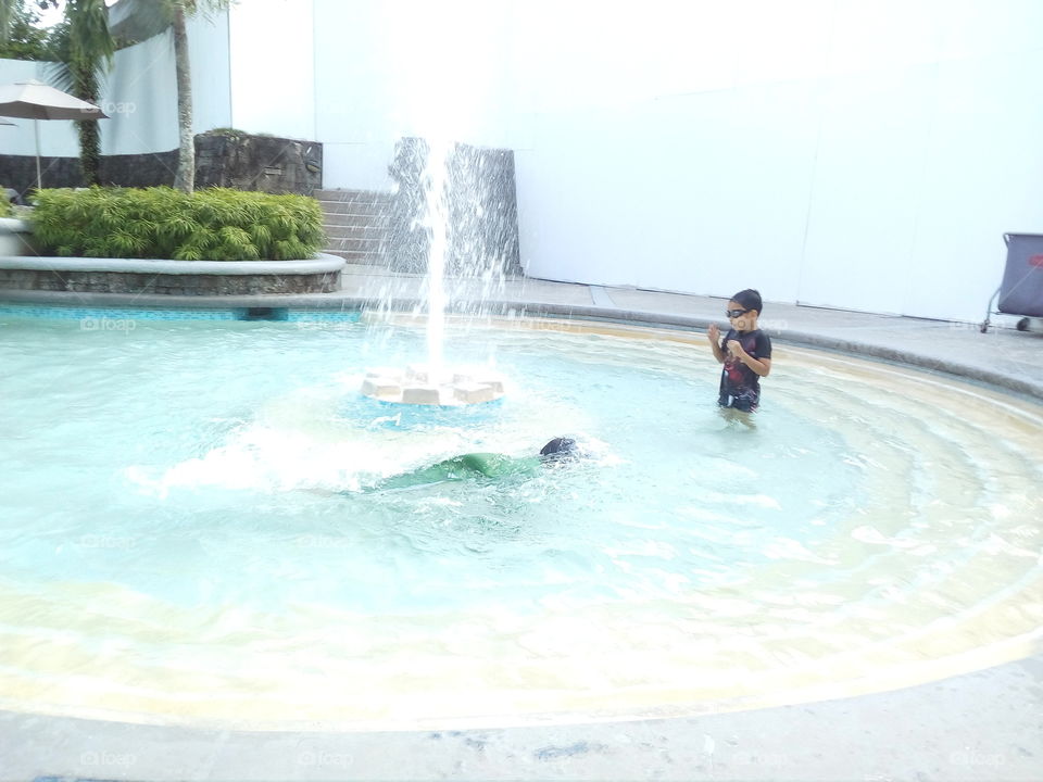 playing time at the pool with my big brother.