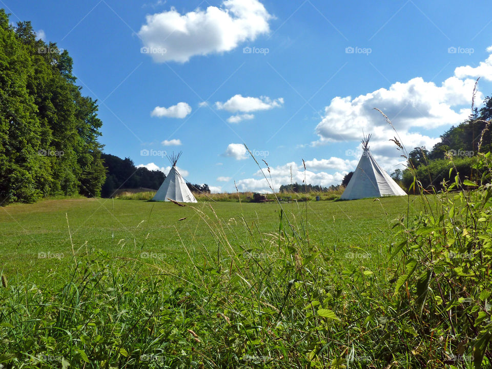 tipis on a summer meadow
