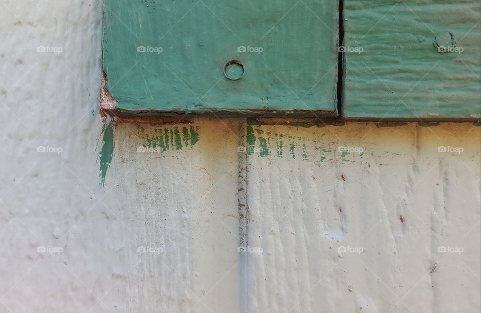 I live green but two years ago we bought this green house, it was badly painted
and there are actually three shades of green. The window frames are a dark green and the main house is two shades if a very light green. While waiting to save enough for new paint we enjoy the green .