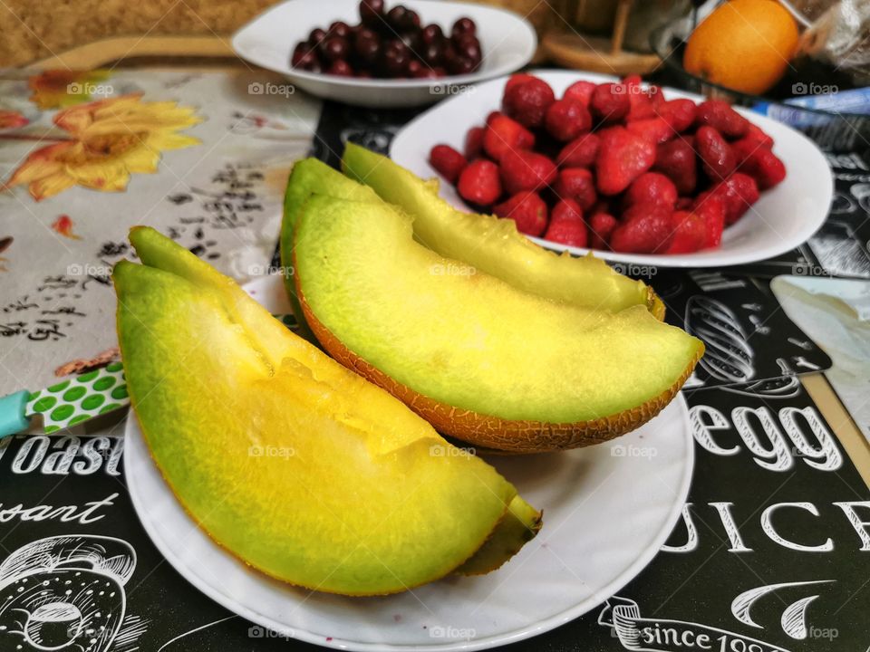 Fruits berry view bio fresh yummy healthy Red strawberry view table day part yellow melon day part