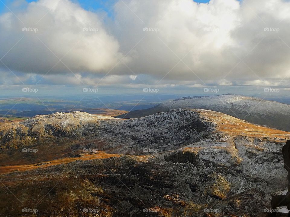 Mountain peaks in snowdonia with snow