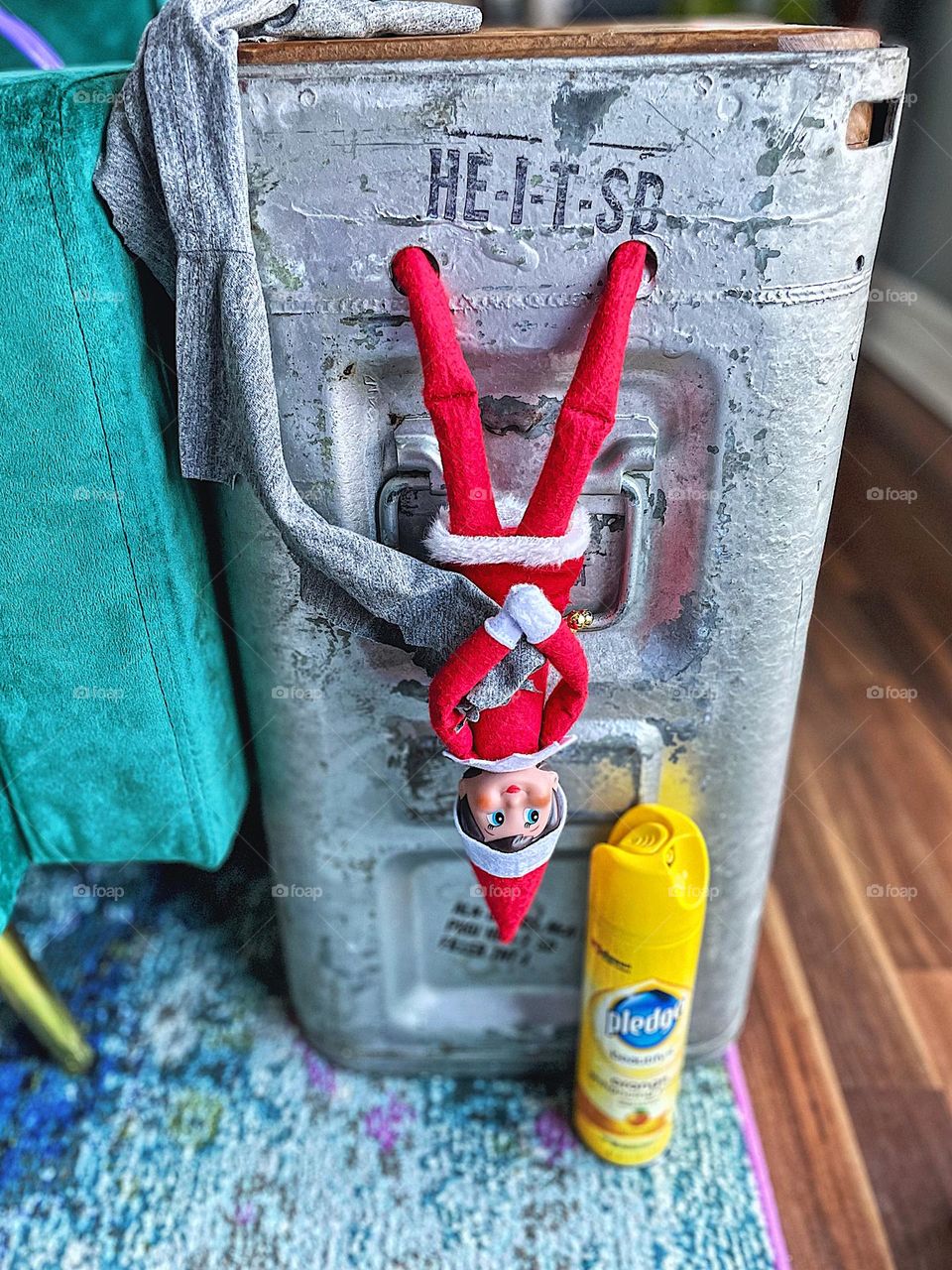 Elf on the Shelf hanging upside down, elf on the shelf helps to dust the house, household chores, daily routines, elf on the shelf antics, funny elf on the shelf ideas, elf on the shelf Christmas traditions, Christmas traditions with children