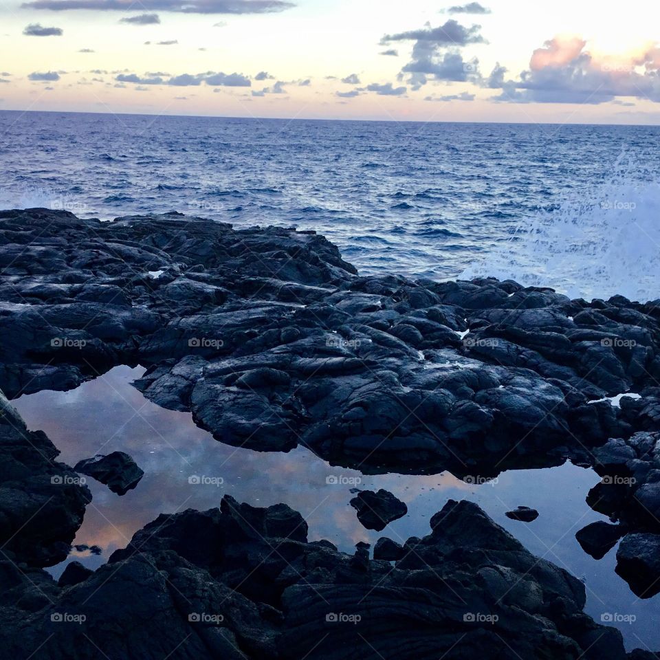 Reflections of the sky on the lava