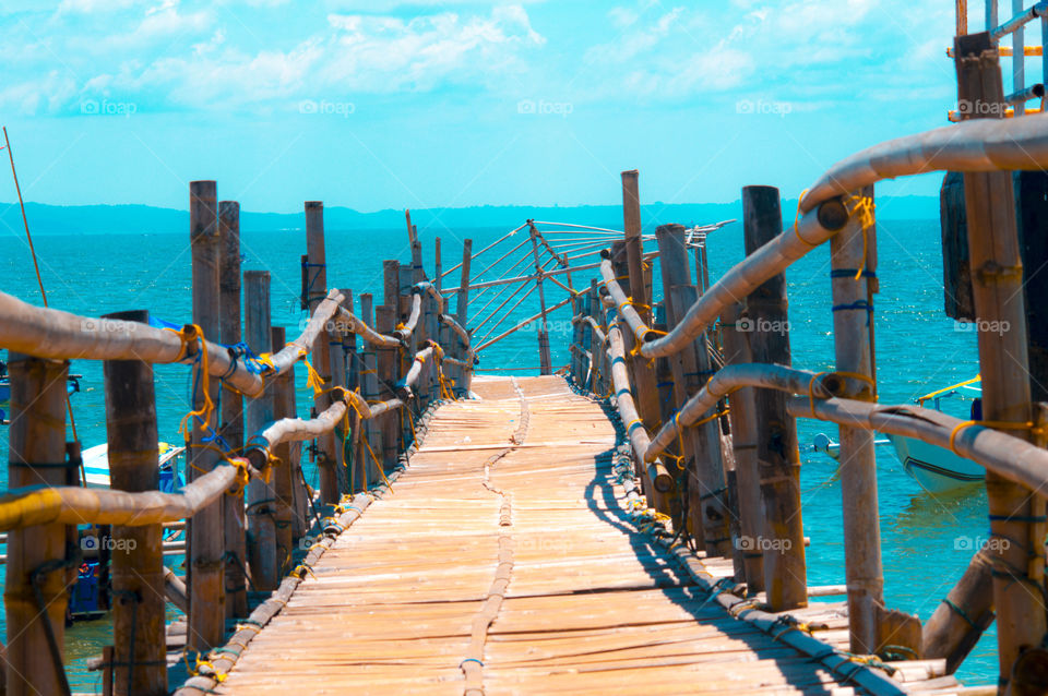 Empty board walk against sea