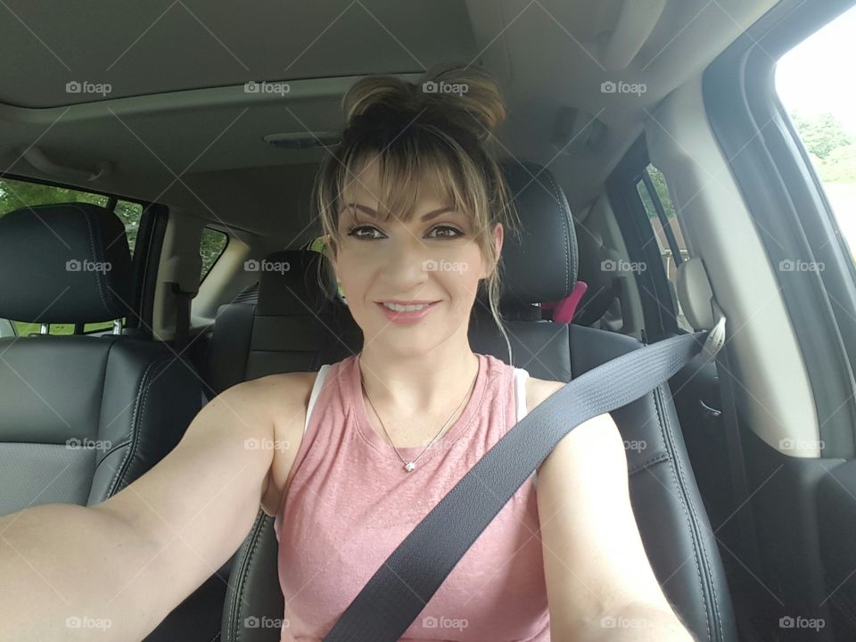 Pretty woman driving car