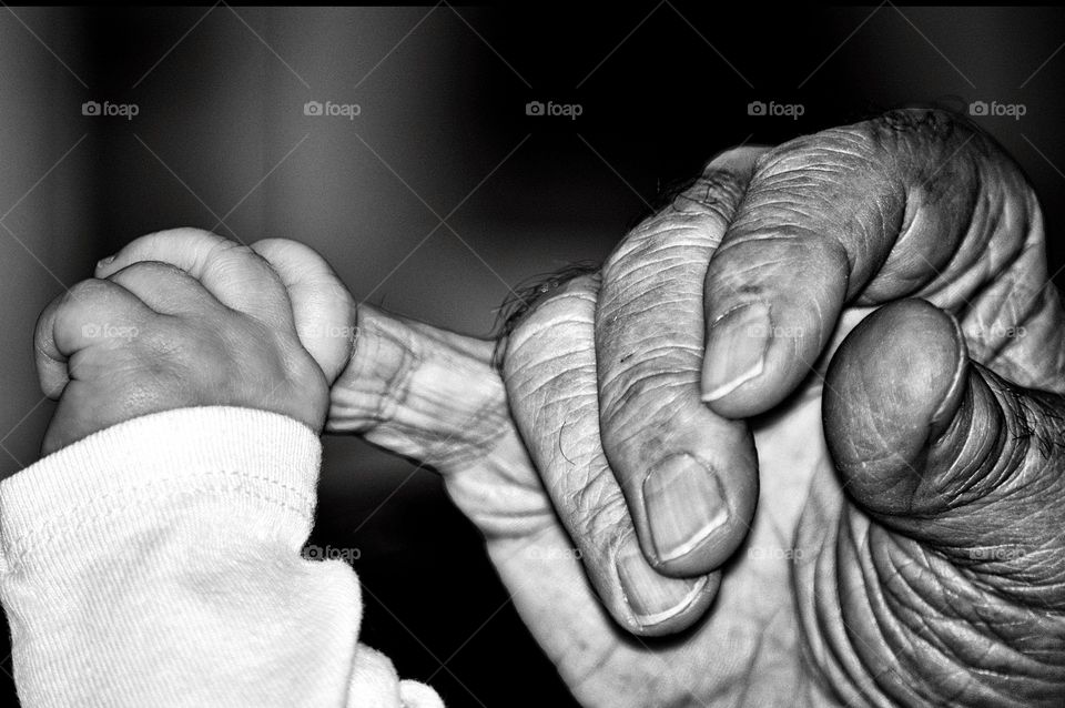 A grandfather greets his granddaughter for the first time. 