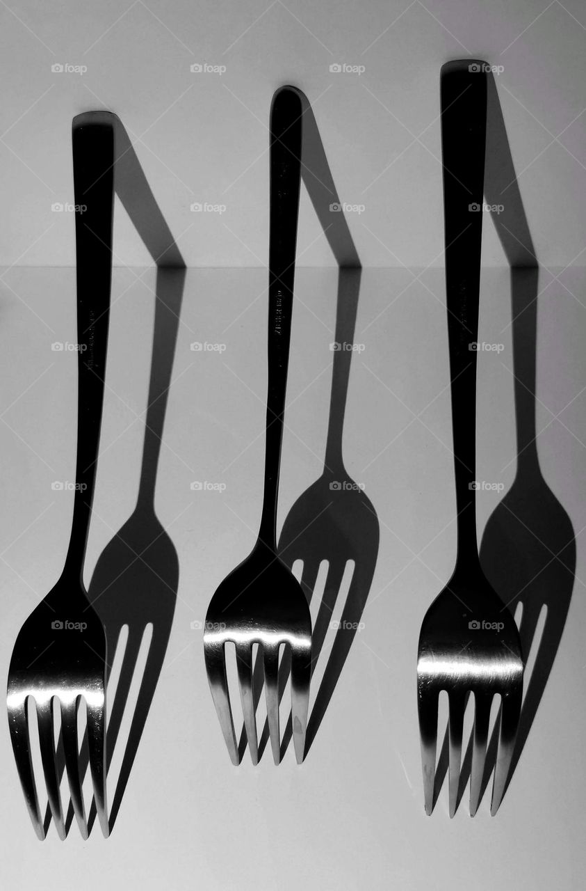 A kitchen forks and shadows. Not ordinary black and white photography.