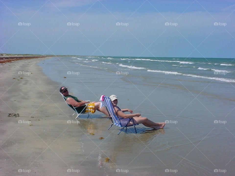 People Relaxing on a beach in the Texas Gulf Coast