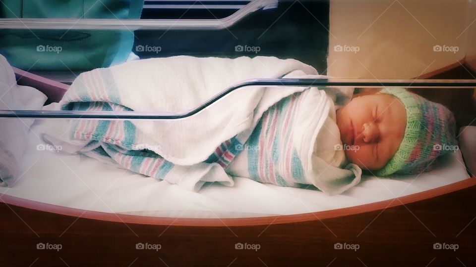Newborn Cecile in bassinet at hospital