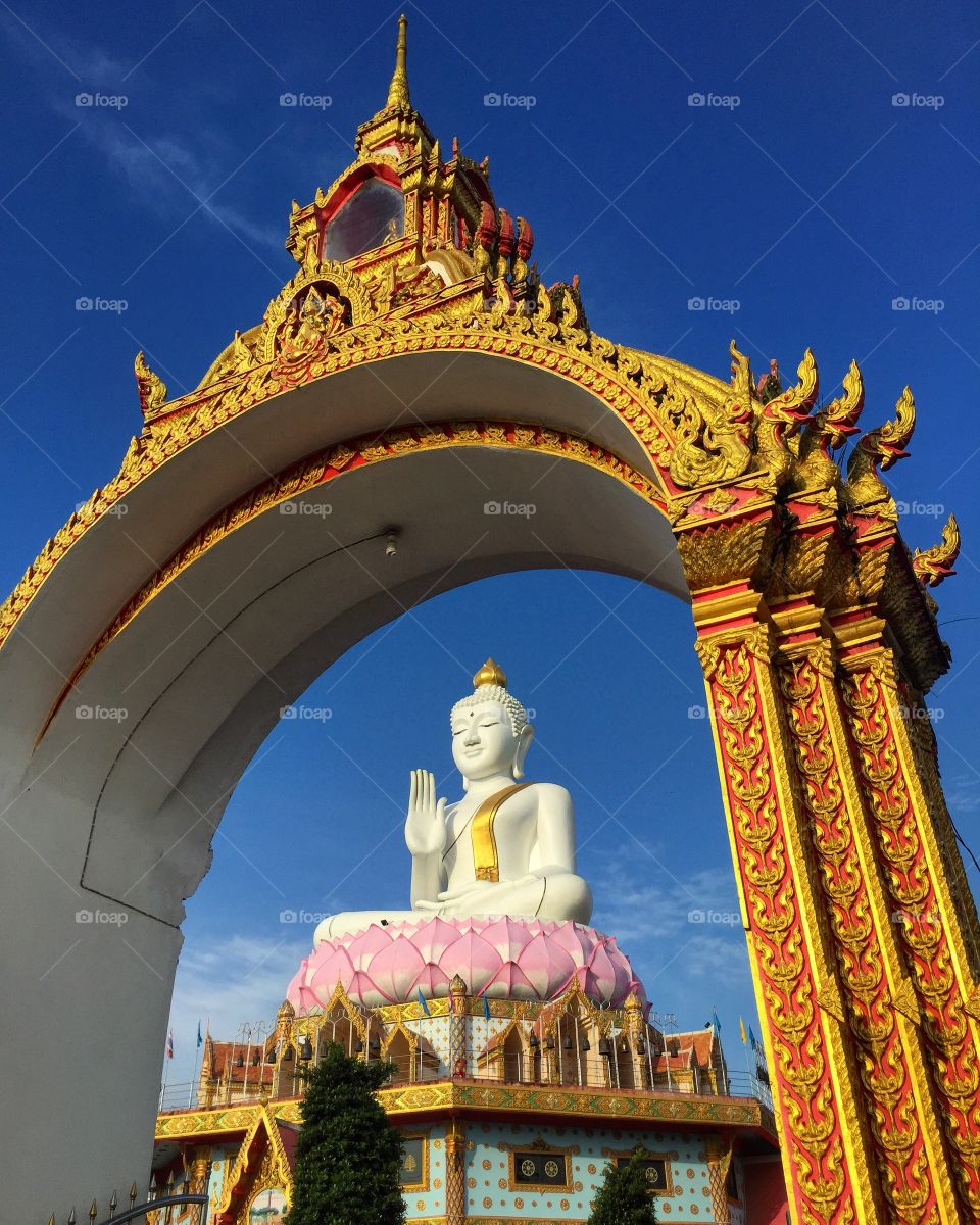 White image of Buddha and the golden gate