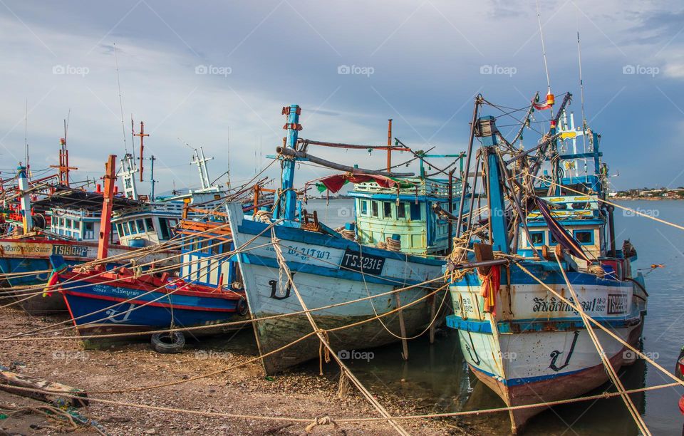 Thai Fisherman's boats at a fishing Pier in Thailand Southeast Asia