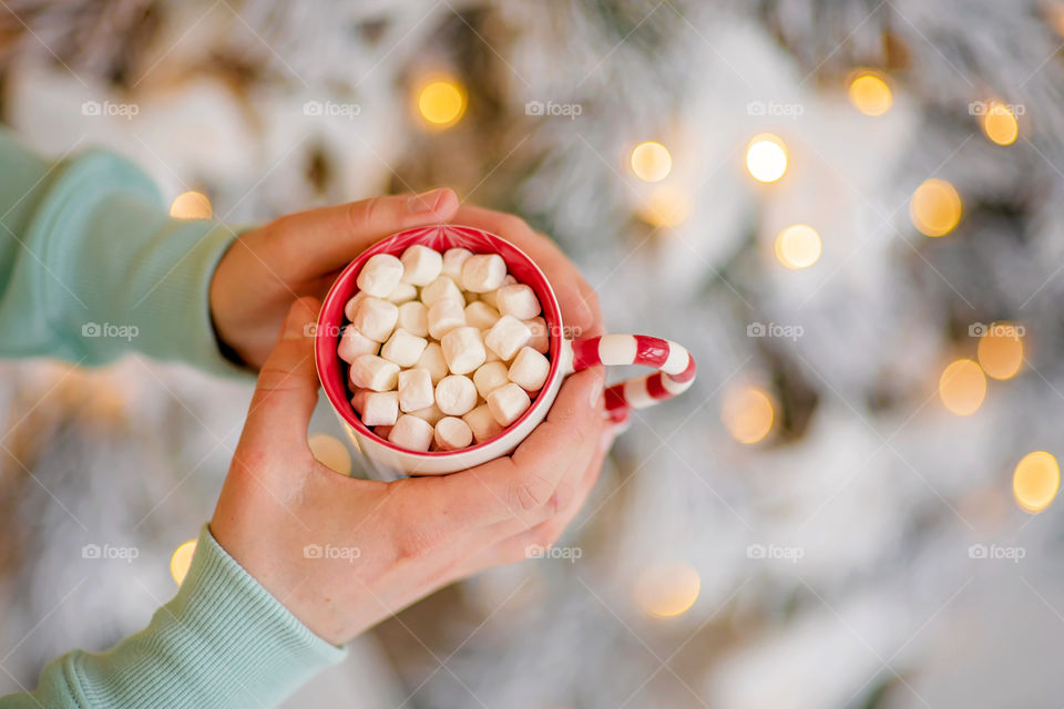 cup of coffee in a cozy festive Christmas atmosphere