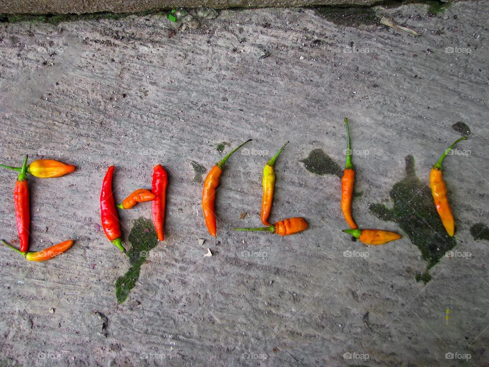 It says CHILLI made from red and green cayenne peppers in bird's eye view