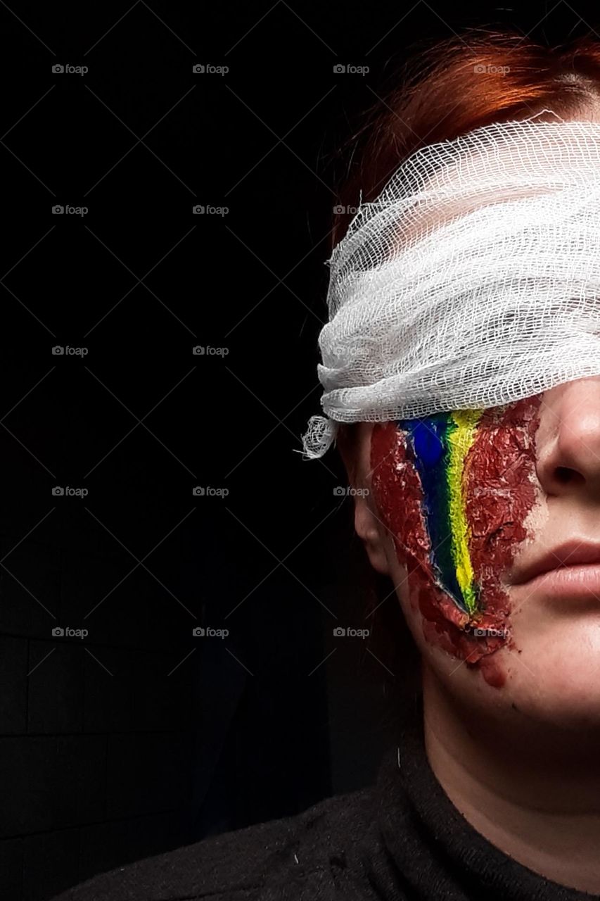 a girl in the image of Ukraine mends her wounds after fighting for her independence in the war