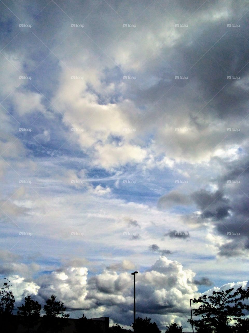 clouds above a parking lot