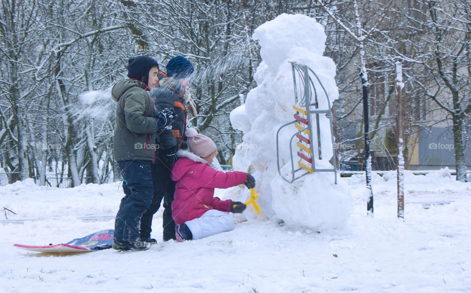 children play in the winter outdoors