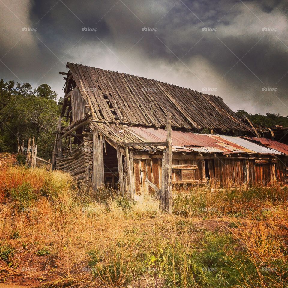 An old barn under a stormy sky
