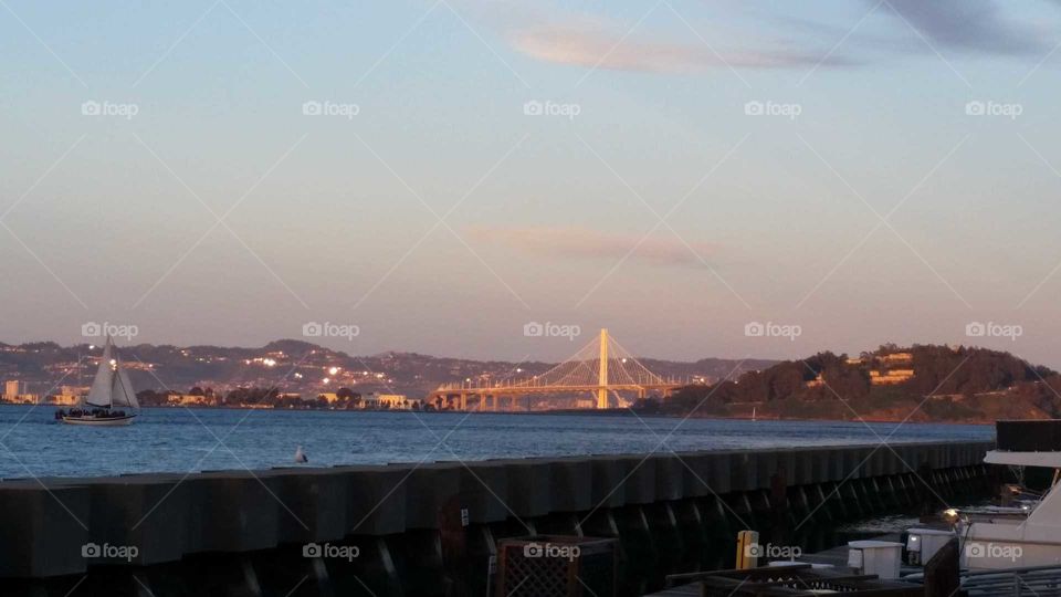 sun setting on the Golden gate bridge
