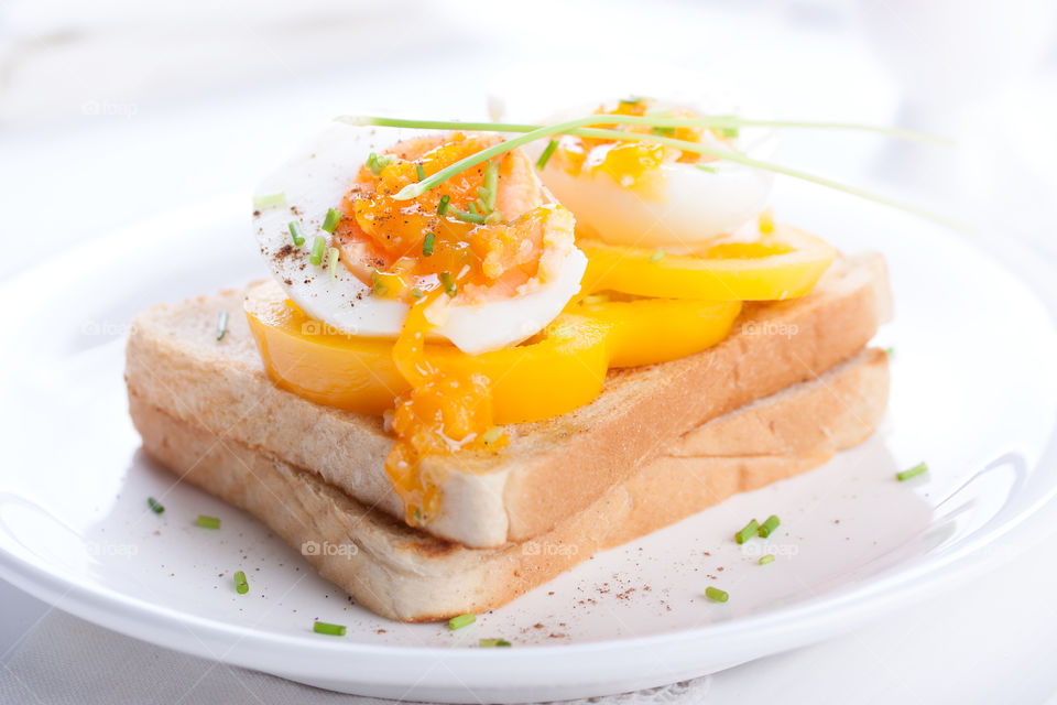 Elegant breakfast with eggs and bread