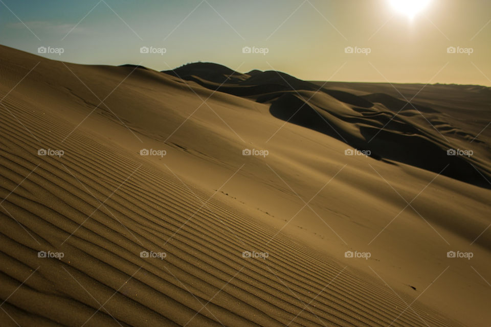 Sand dune in Huacachina, Peru 