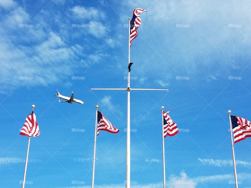 Flag poles fly at Elizabeth, nj waterfront