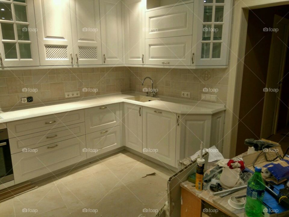 white kitchen in repair mess