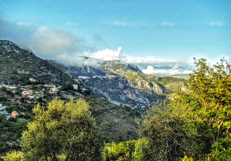 Morning fog lifting over Riviera and mountainous Eze landscape