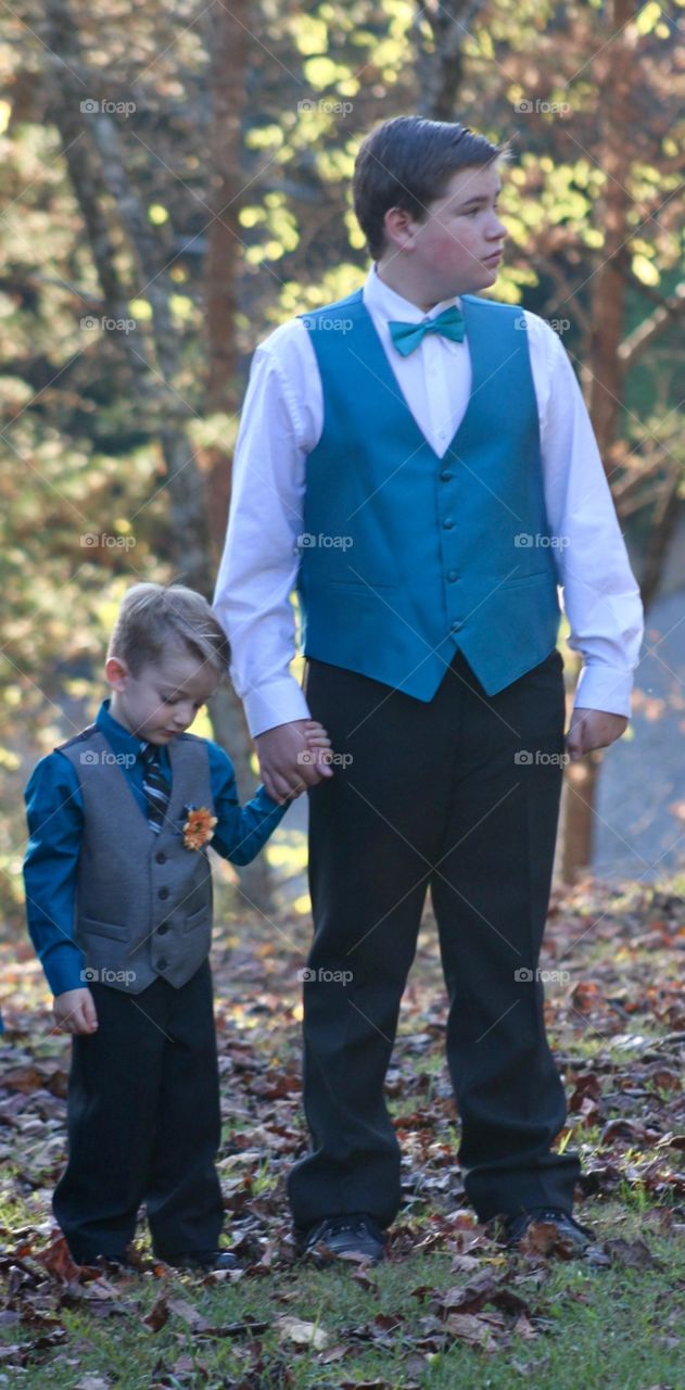 Holding hands with brother