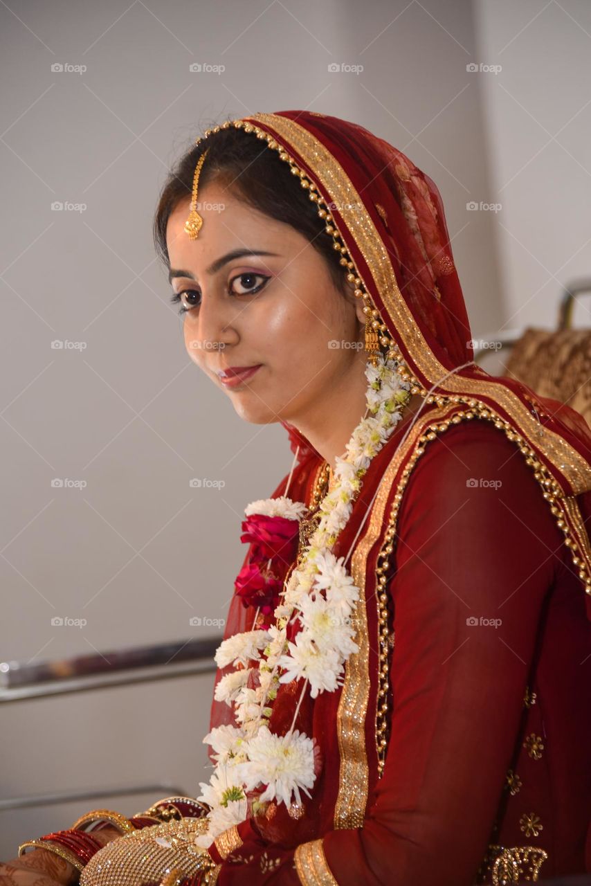 Portrait of a lady wearing heavy gold jewellery